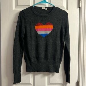 Woman’s gray multi-color heart sweater